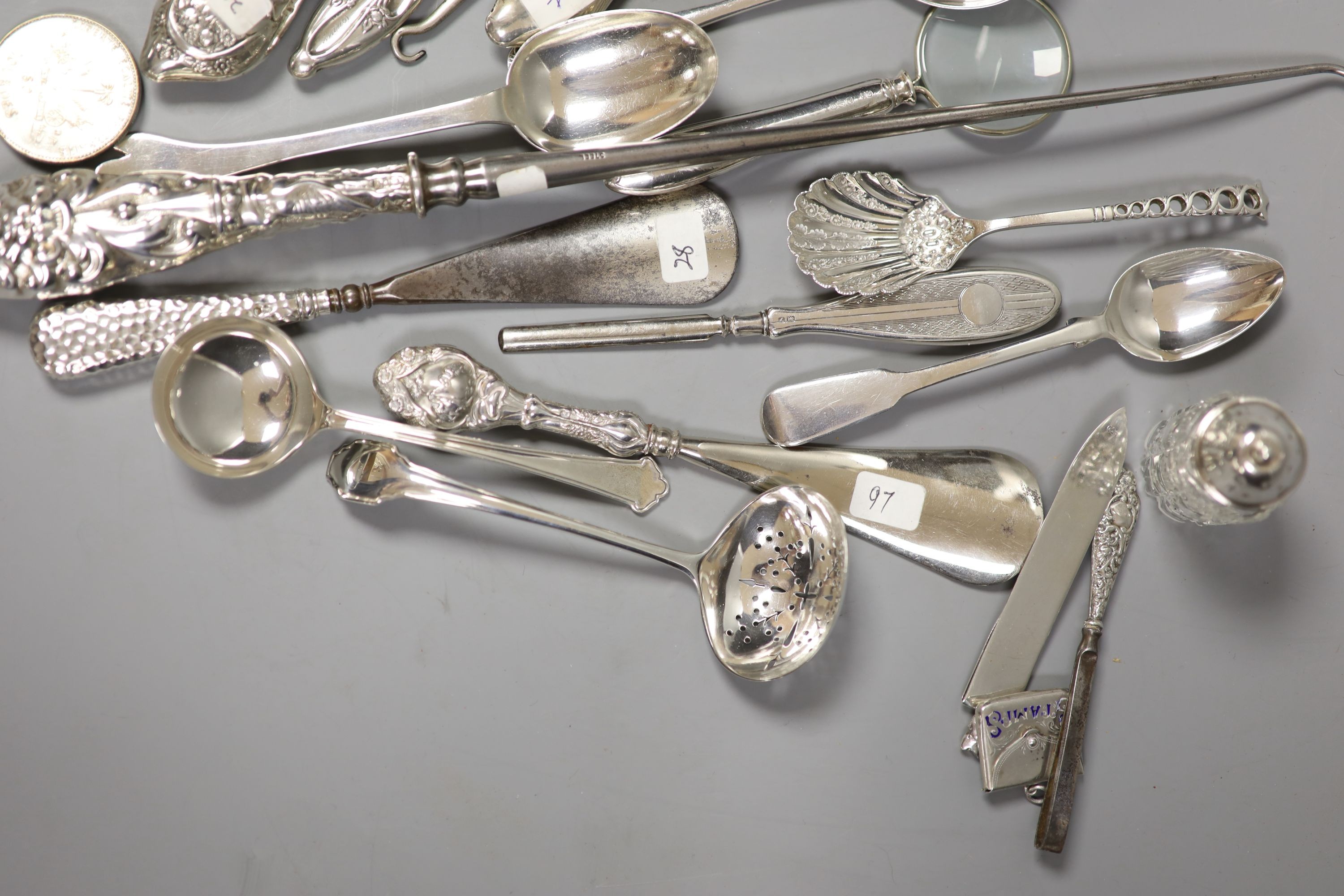 Assorted button hooks and other small silver including spoons, magnifying glass, glove stretchers, shooting related medallion and enamelled stamp case, etc.